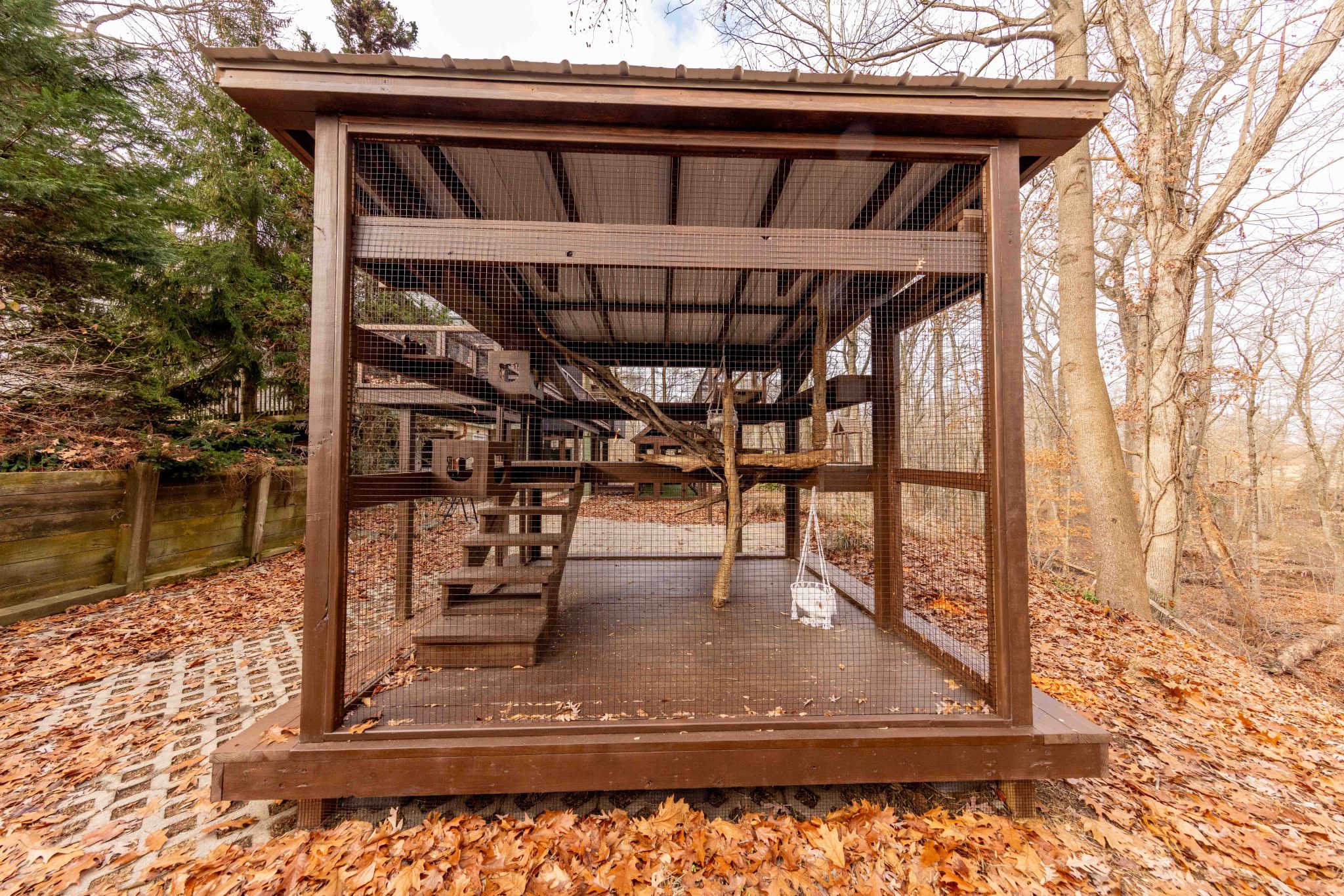 Large brown custom catio with long cat tunnel in New Jersey
