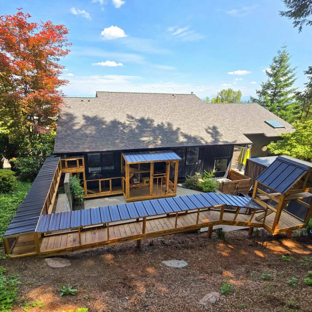Aerial view of an extensive backyard catio system with tunnels and enclosures