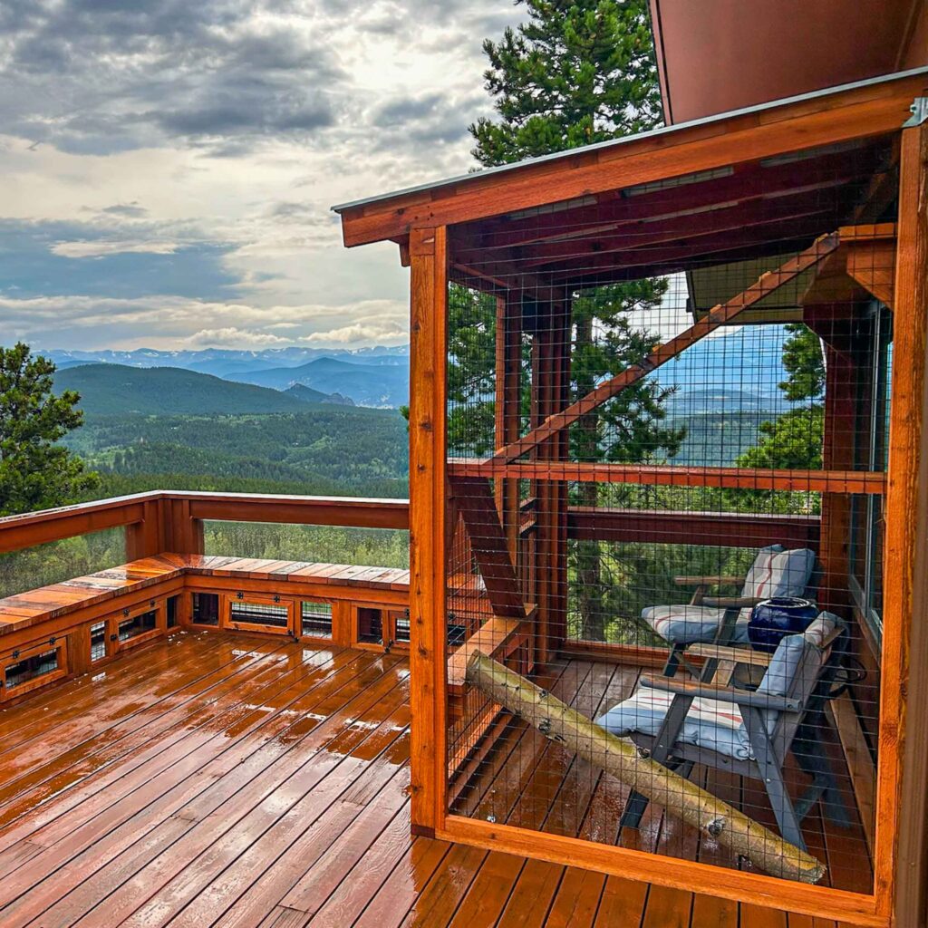 Mountain-view catio with wood frame on a deck