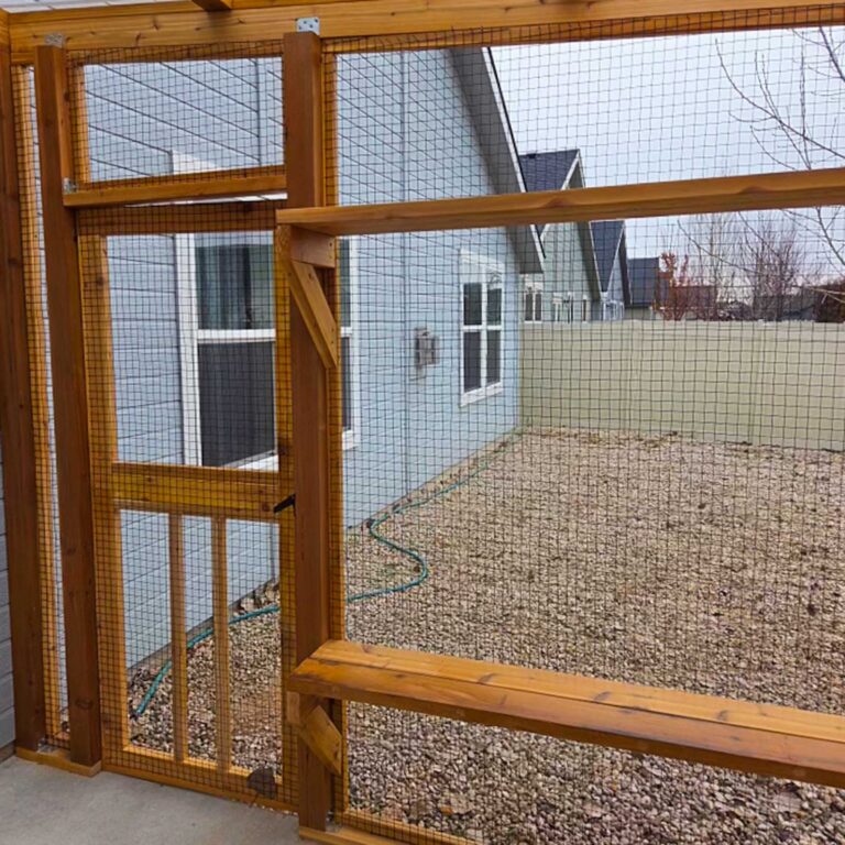 Catio door and mesh wall with interior bench-style shelf along the bottom.